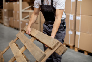 Close up hands holding wooden item